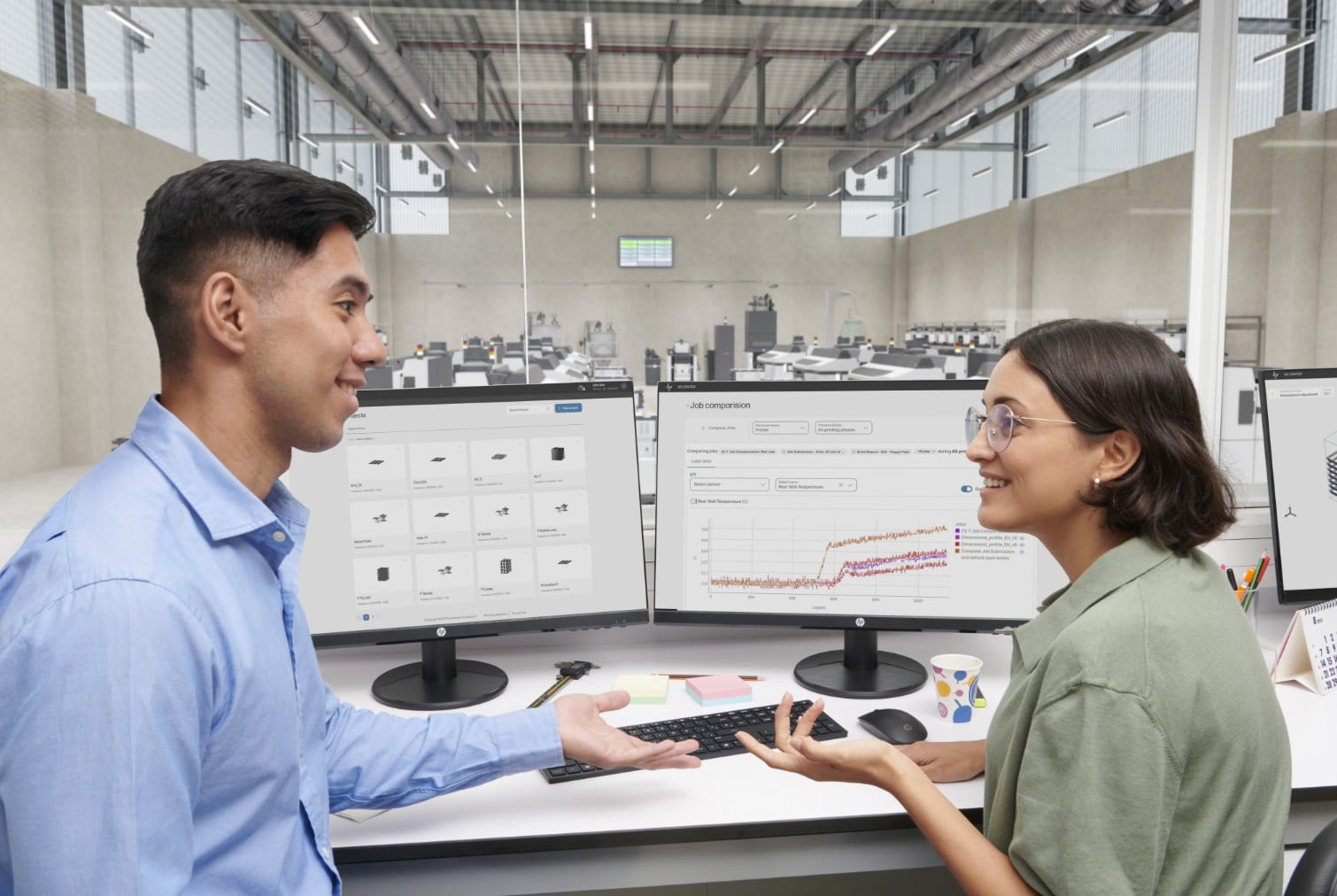 3D engineers discussing in front of PC with 3d printing software screens