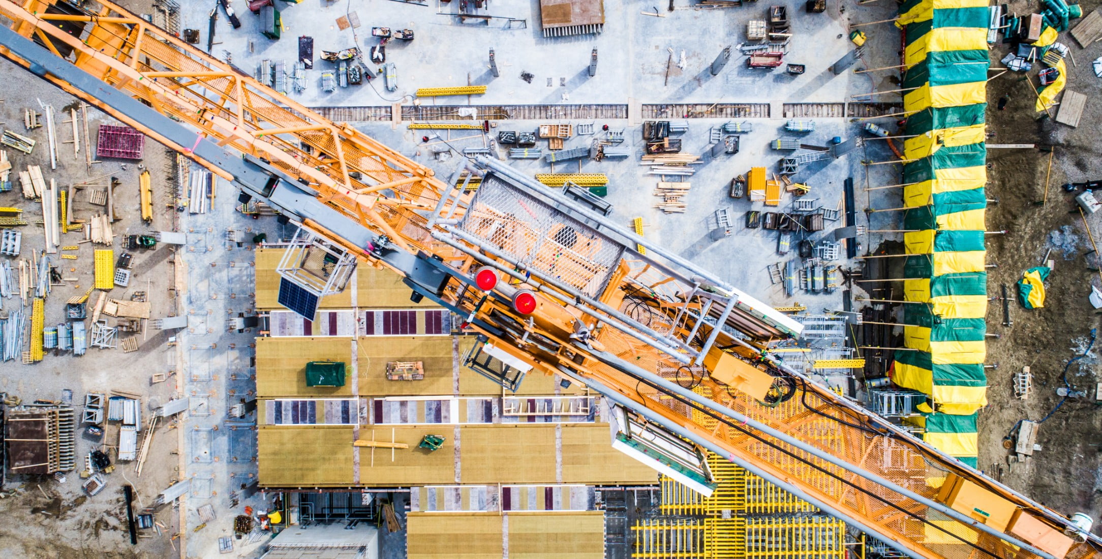 Aerial view of a crane over a construction site.