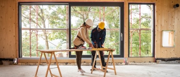 Architect and contractor assessing how using a framing layout robot has impacted a project