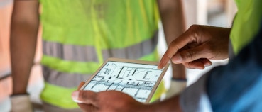 Architect and contractor using tablets and virtual designs as part of the trend toward digitalization in construction