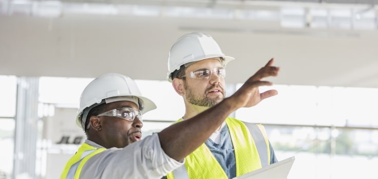 Construction experts visualizing next steps and implementing automation technology