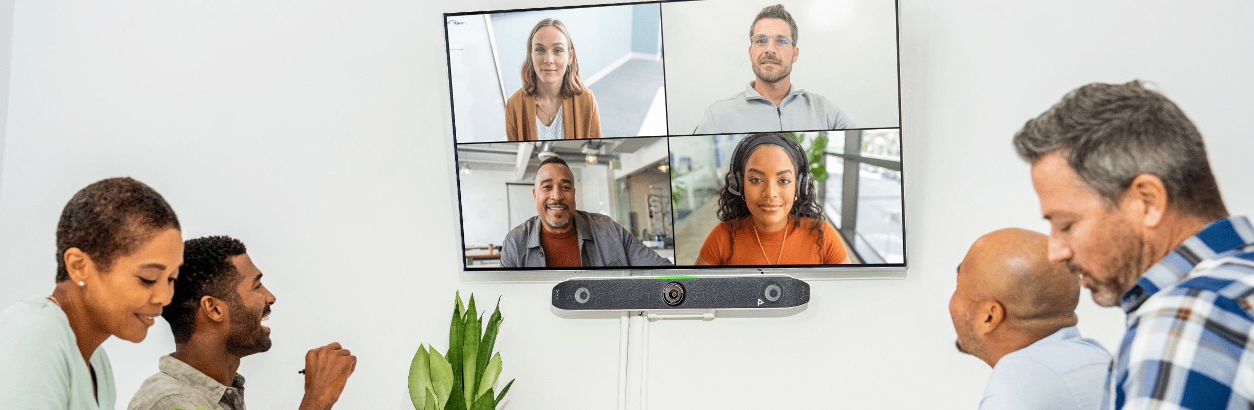 People in a video conferencing call using Poly Studio X52 all-in-one video bar