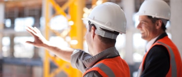 Co-workers surveying the results of using field printers to streamline project completion