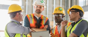 Construction team seeing how a construction robot has simplified communications and operations