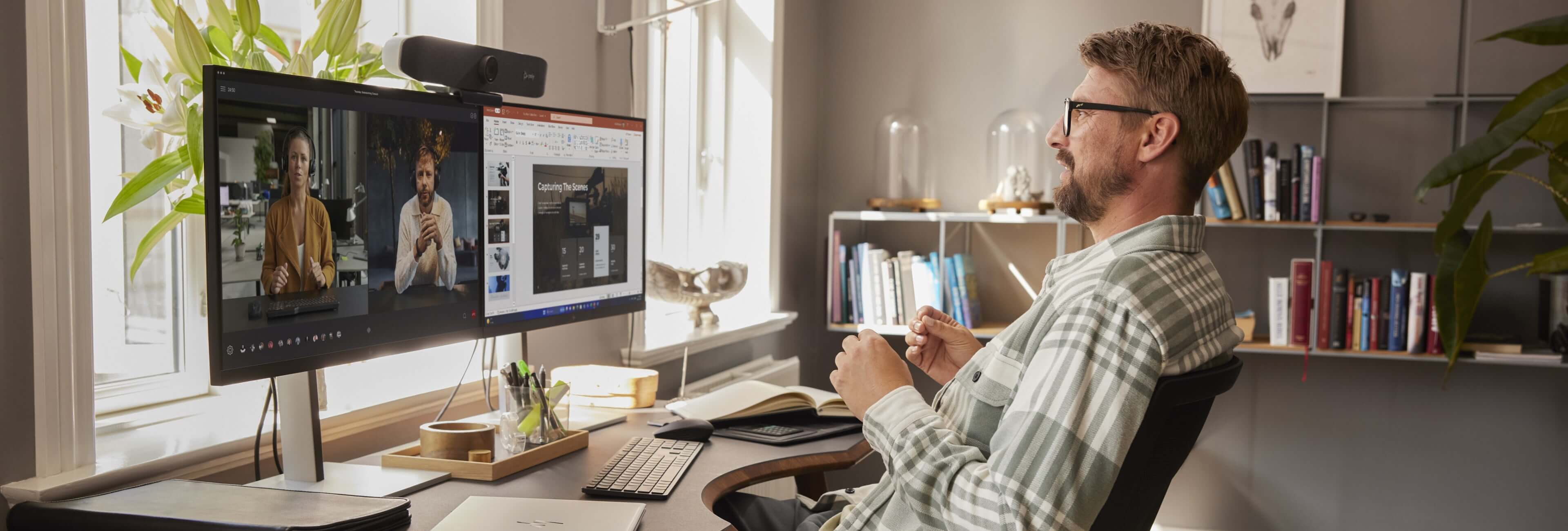 Man working on an HP laptop from home.