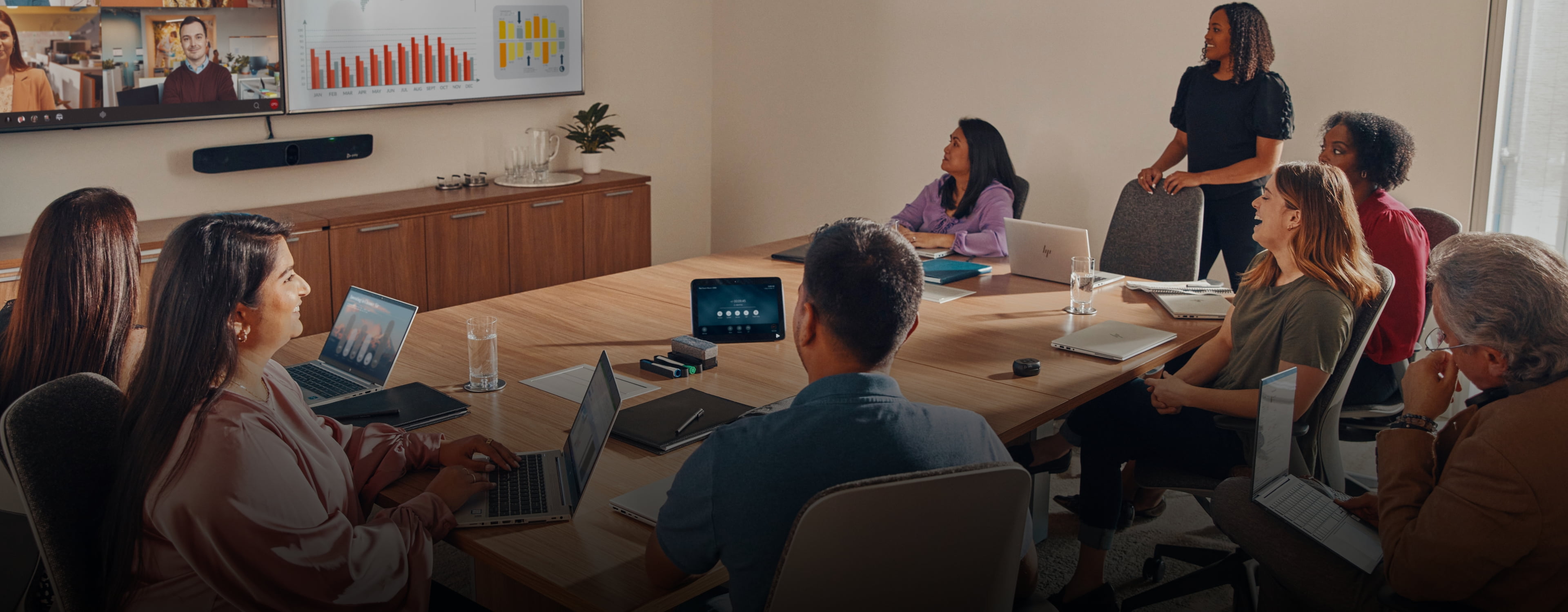 People in a meeting room on a video conference call