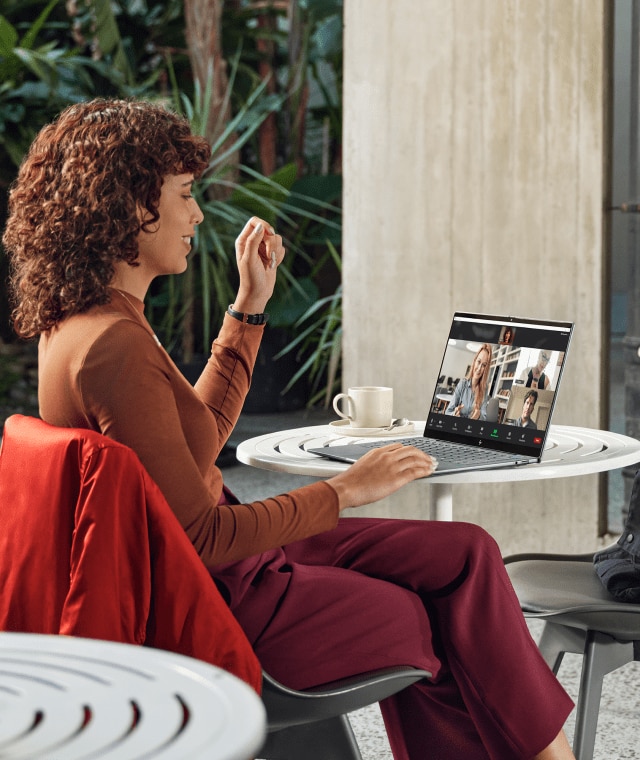 Woman take video meeting on HP laptop