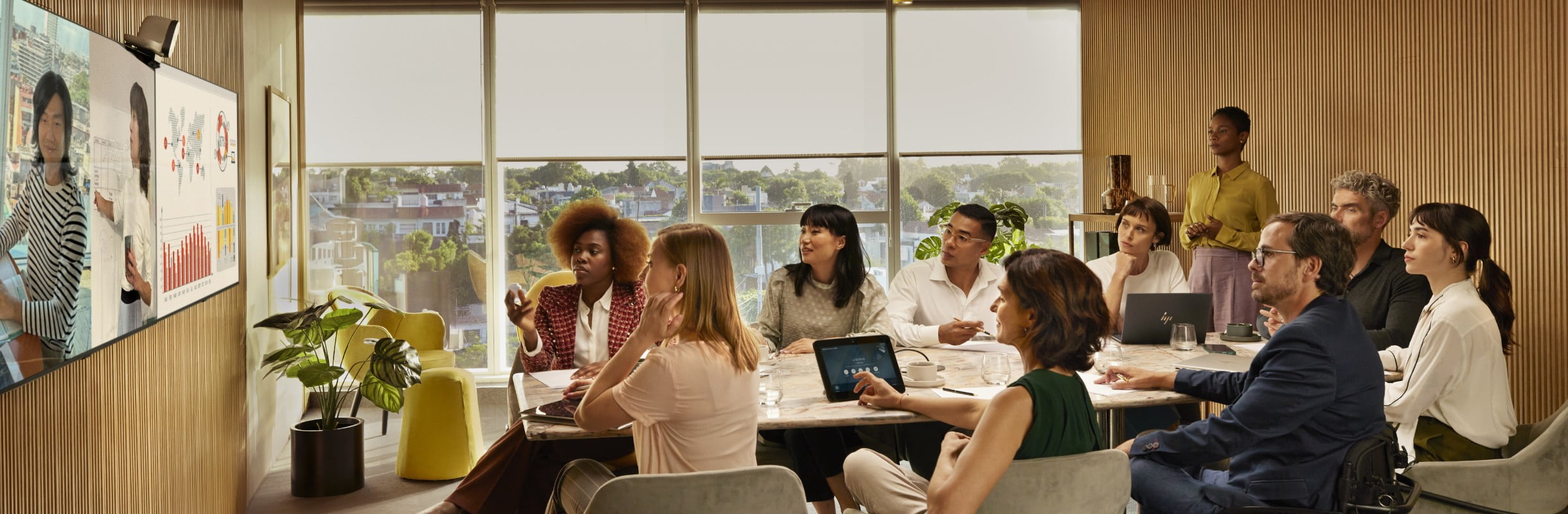 People in a meeting room on a video conference call