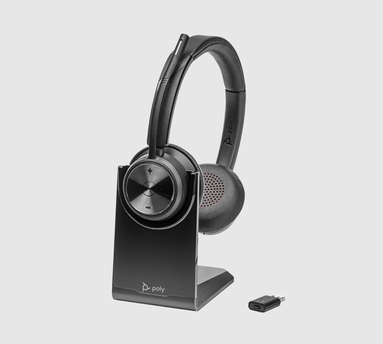 Poly Savi 7320 UC series wireless headset on desktop charging stand shown alongside USB DECT adapter