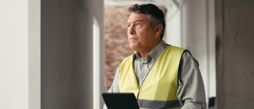 Site manager considering the challenges of using robots in the construction industry