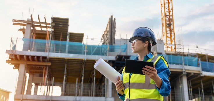 Mechanical engineer using a mix of traditional and advanced systems to complete construction projects