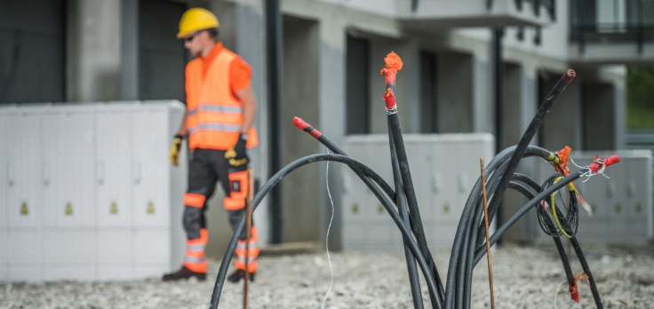 Cable laying robots positioning cables through underground tunnels on a construction site